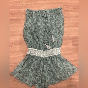 Women’s Khush Romper Size S
Color is Turquoise